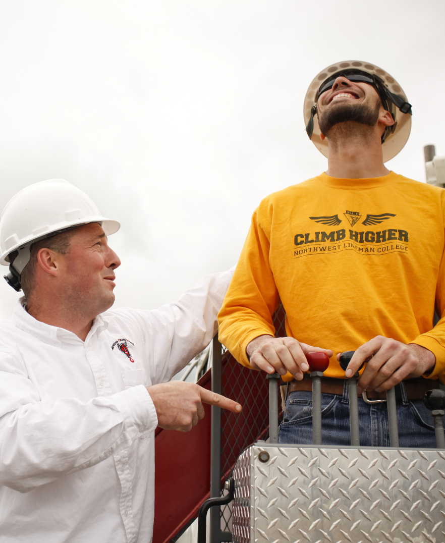 Crane Trainer and Student operating mobile crane in practical exam/test