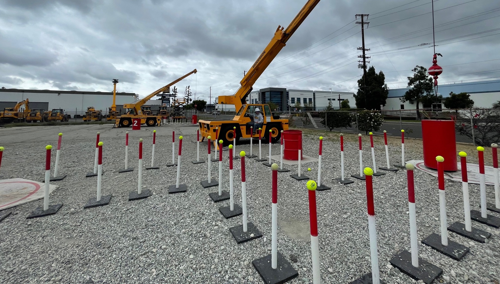 crane operator navigating zigzag course in practical exam and barrel exam