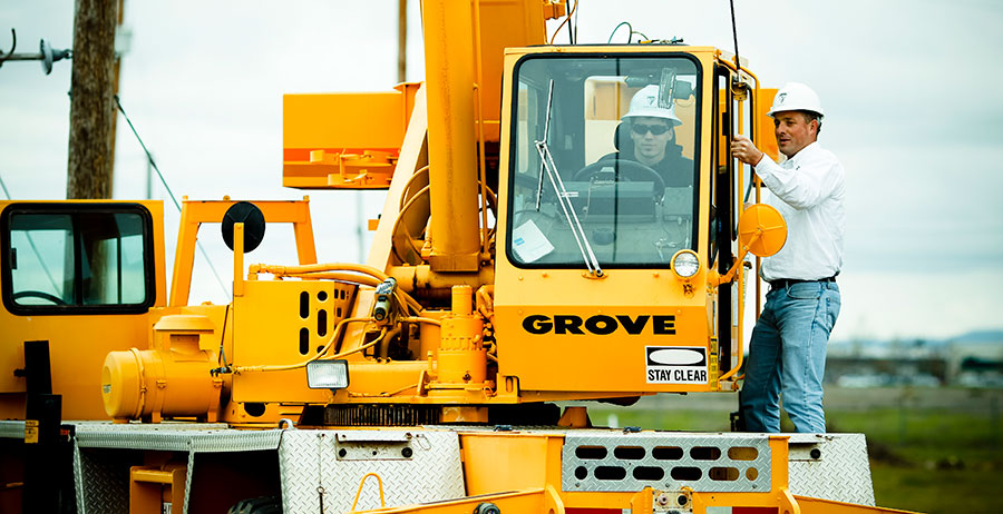 crane-operator-receiving-hands-on-crane-training-in-the-field-on-mobile-crane crane operator receiving hands on crane training in the field on mobile crane
