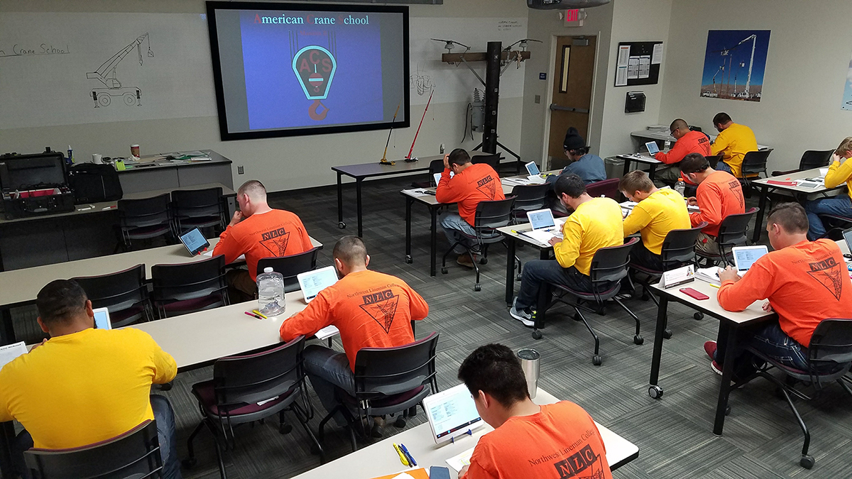 students in crane operator classroom studying for written exam