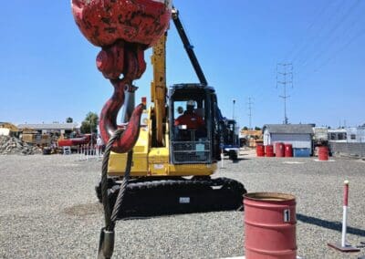 Crane Operator Certification Practical Exam Zig Zag Course - Hand Signals practiced as exam is taken (close up of headache ball)